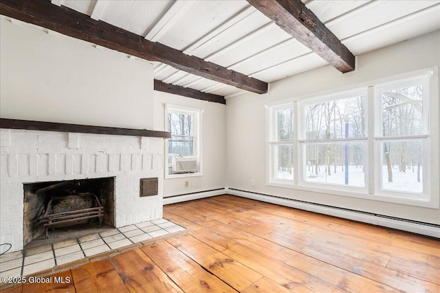 unfurnished living room with beamed ceiling, a fireplace, a baseboard heating unit, and wood-type flooring