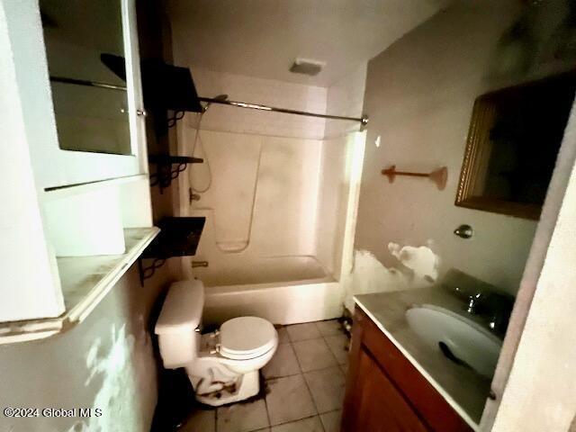 full bathroom with tile patterned flooring, vanity, bathing tub / shower combination, and toilet