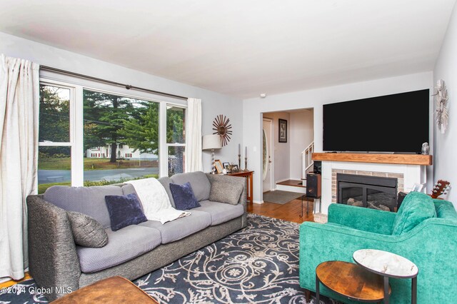 living room with a fireplace and hardwood / wood-style floors