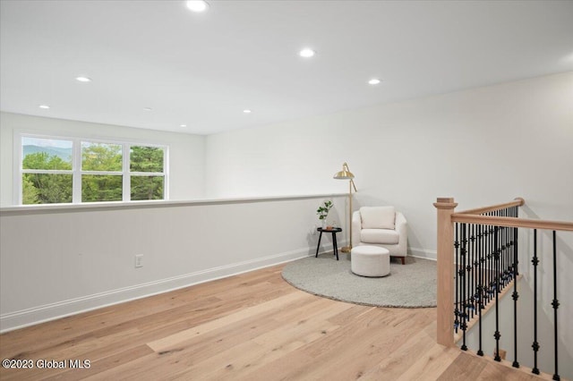 sitting room featuring light hardwood / wood-style floors