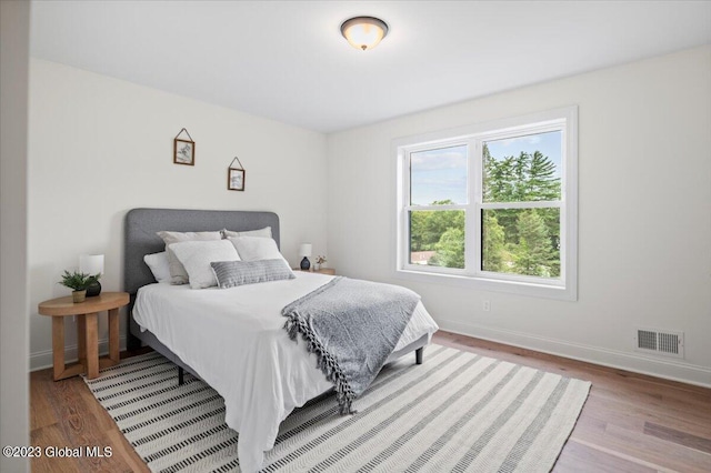 bedroom with light wood-type flooring