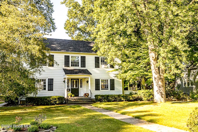 colonial home with a front lawn