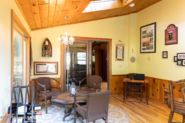 dining room with an inviting chandelier, wood ceiling, vaulted ceiling, and light hardwood / wood-style flooring