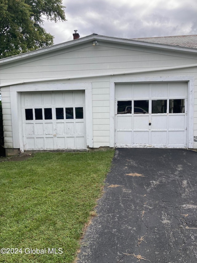 garage featuring a yard