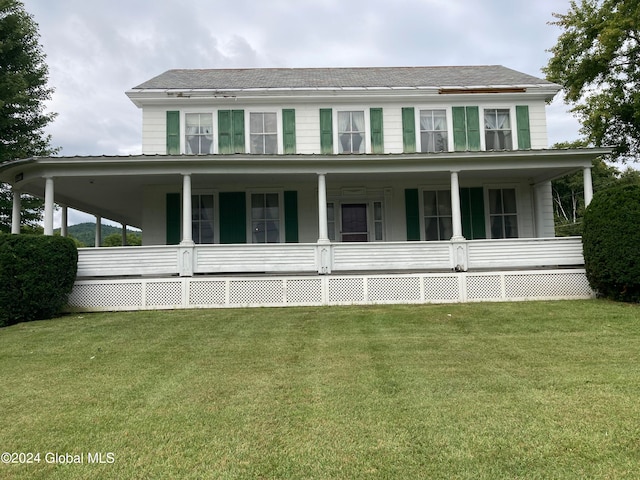 view of front of house with a front lawn and covered porch