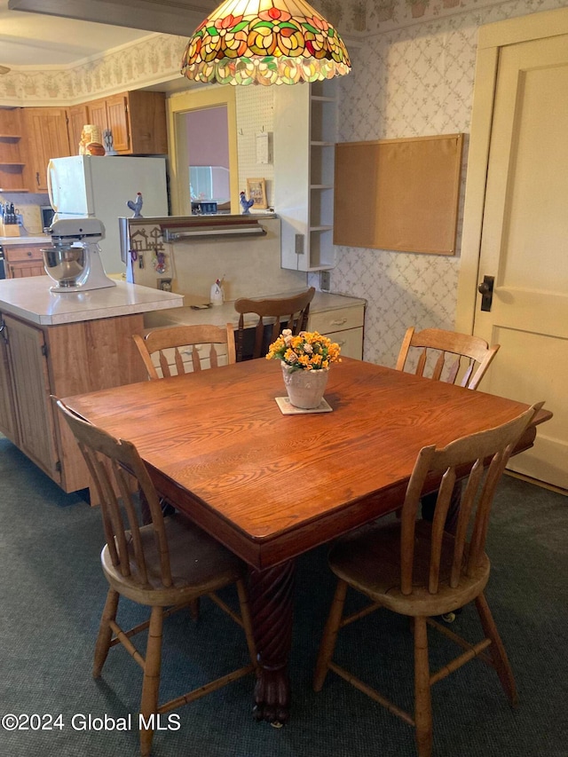 dining space featuring carpet flooring