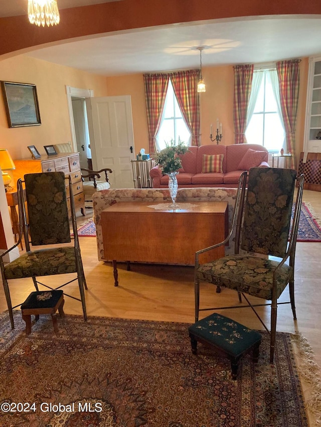 dining room featuring an inviting chandelier, plenty of natural light, and light hardwood / wood-style flooring