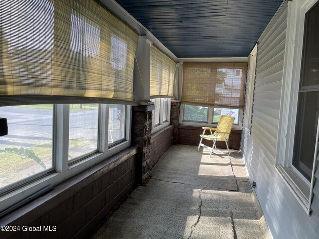 unfurnished sunroom with a healthy amount of sunlight