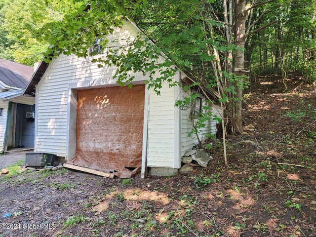 view of home's exterior featuring an outbuilding