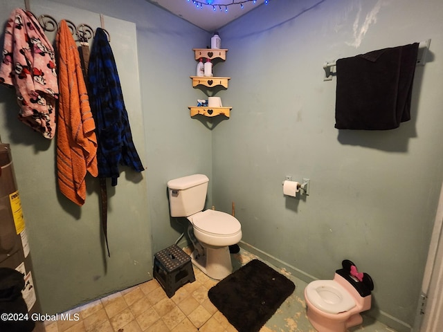 bathroom featuring tile patterned flooring and toilet