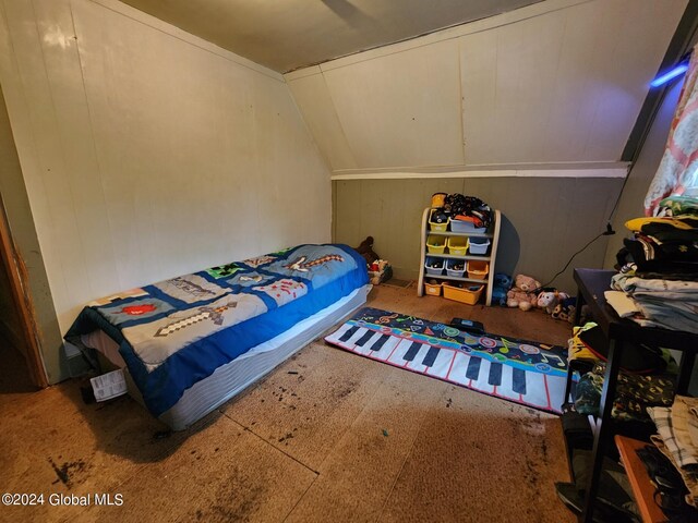 bedroom featuring lofted ceiling