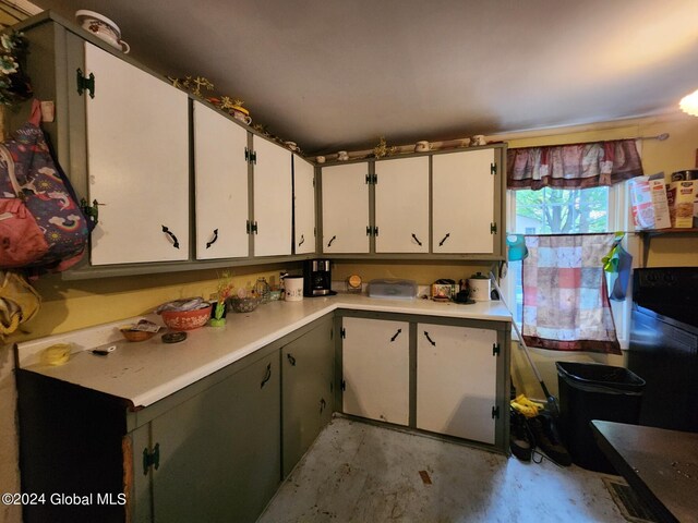 kitchen featuring white cabinets