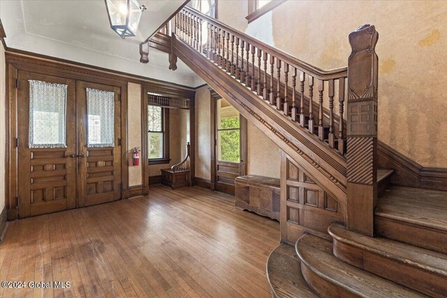 entrance foyer featuring hardwood / wood-style flooring and french doors