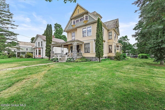 victorian house with a front yard