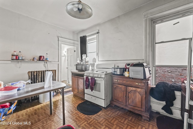 kitchen featuring black microwave and electric stove