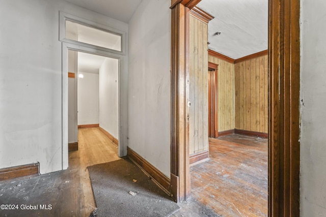 hall featuring baseboards and ornamental molding