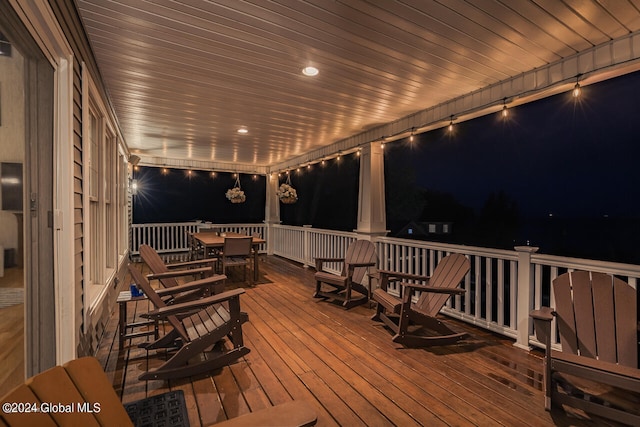 view of deck at twilight