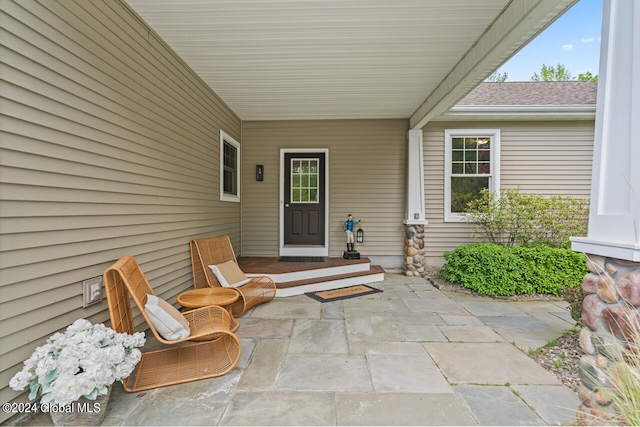 property entrance featuring a patio