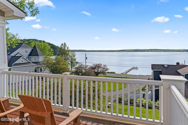 wooden deck with a water view