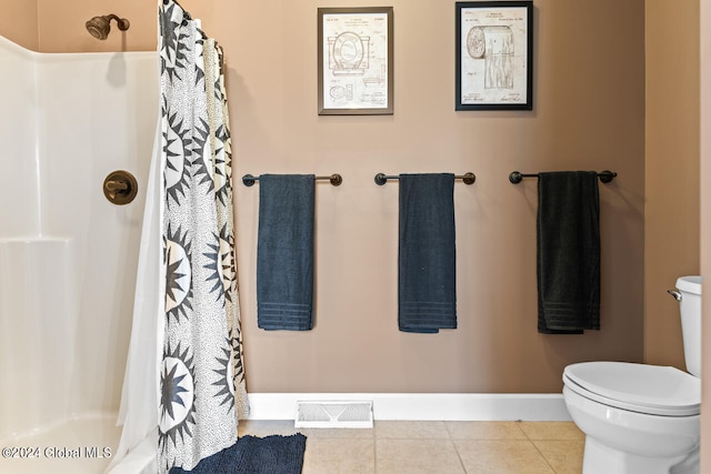 bathroom featuring walk in shower, toilet, and tile patterned floors