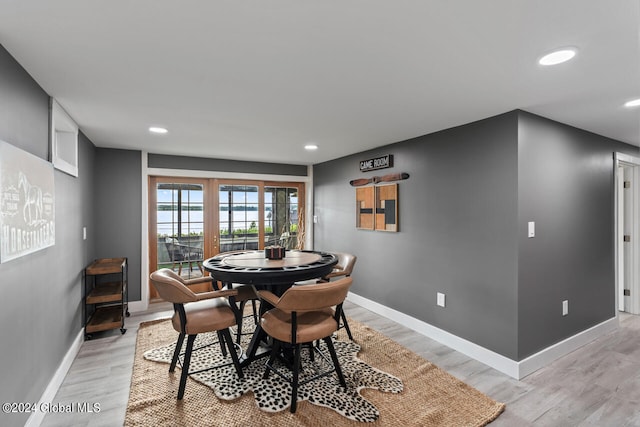 dining space featuring light hardwood / wood-style floors