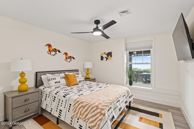 bedroom featuring ceiling fan and light hardwood / wood-style floors