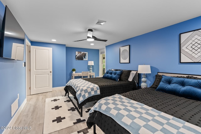 bedroom featuring ceiling fan and light hardwood / wood-style floors