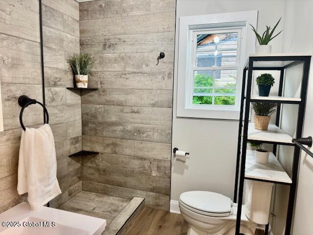 26 N 2nd Ave, Broadalbin, NY 12025 - bathroom with tiled shower and wood finished floors