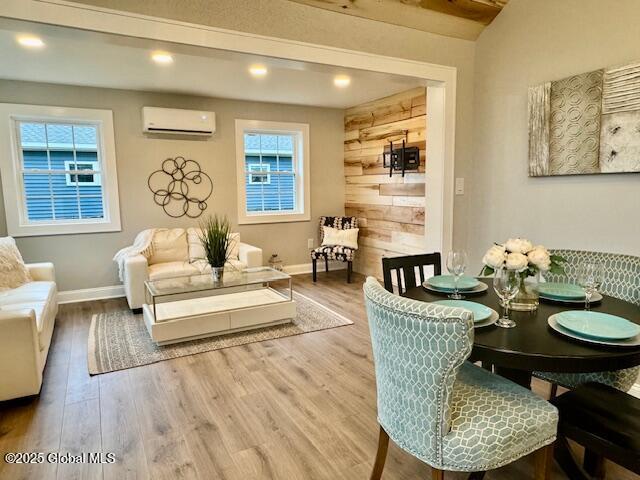 26 N 2nd Ave, Broadalbin, NY 12025 - dining space with a wall mounted air conditioner, wood finished floors, and recessed lighting