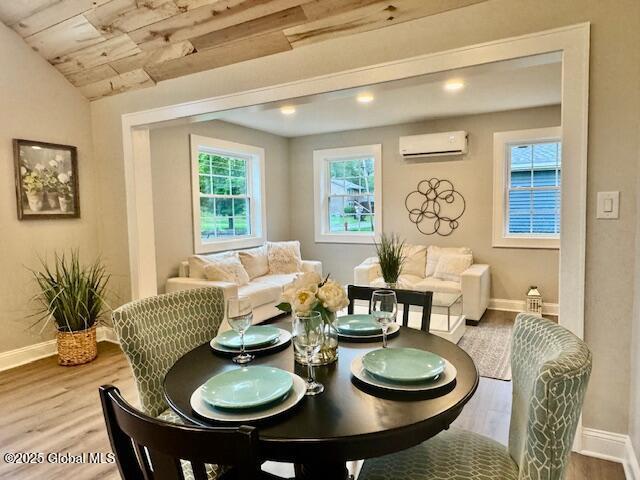 26 N 2nd Ave, Broadalbin, NY 12025 - dining area with a wall mounted AC, wood finished floors, wooden ceiling, and recessed lighting