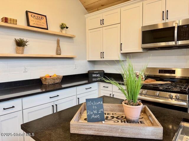 26 N 2nd Ave, Broadalbin, NY 12025 - kitchen with stainless steel appliances, open shelves, tasteful backsplash, white cabinetry, and vaulted ceiling