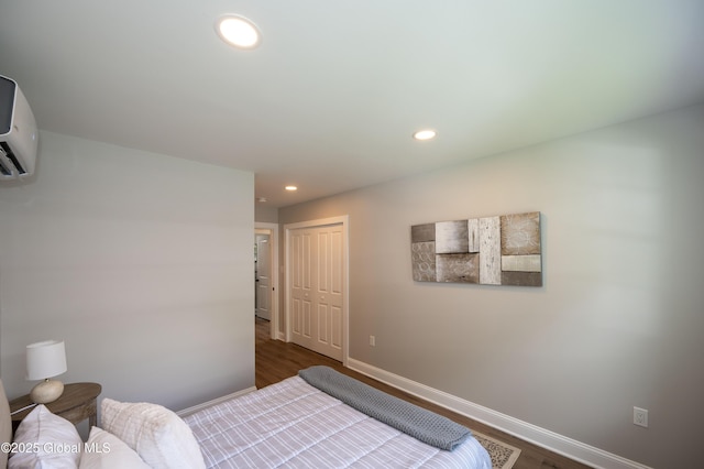 26 N 2nd Ave, Broadalbin, NY 12025 - bedroom with dark wood finished floors, a closet, recessed lighting, and an AC wall unit