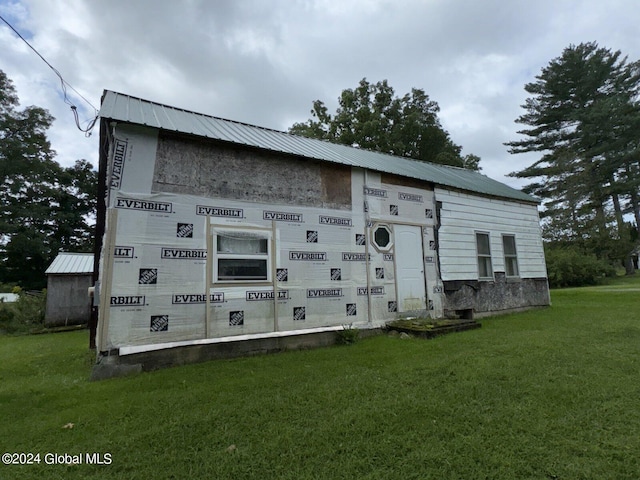 unfinished property featuring a front lawn