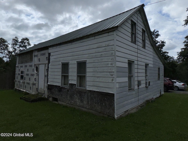 view of property exterior featuring a yard