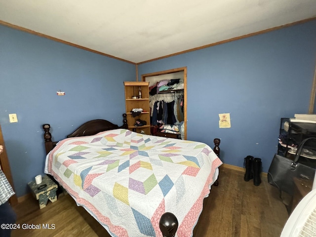 bedroom featuring a closet, hardwood / wood-style floors, and ornamental molding