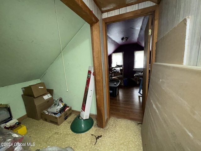 interior space featuring wood-type flooring and lofted ceiling