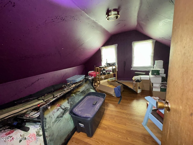 bonus room featuring light hardwood / wood-style floors and lofted ceiling