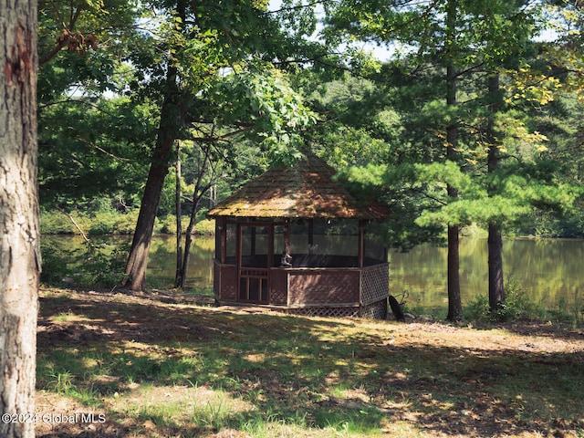 view of outdoor structure with a gazebo and a water view