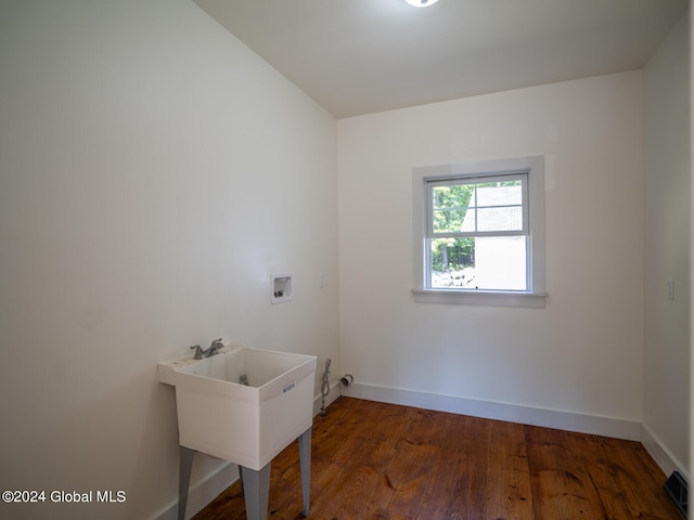 laundry room featuring hookup for a washing machine and dark hardwood / wood-style floors