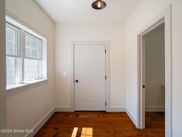 corridor with dark wood-type flooring