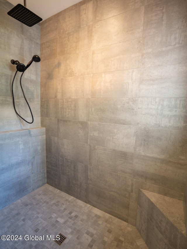 bathroom with a tile shower