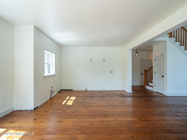 empty room with hardwood / wood-style flooring