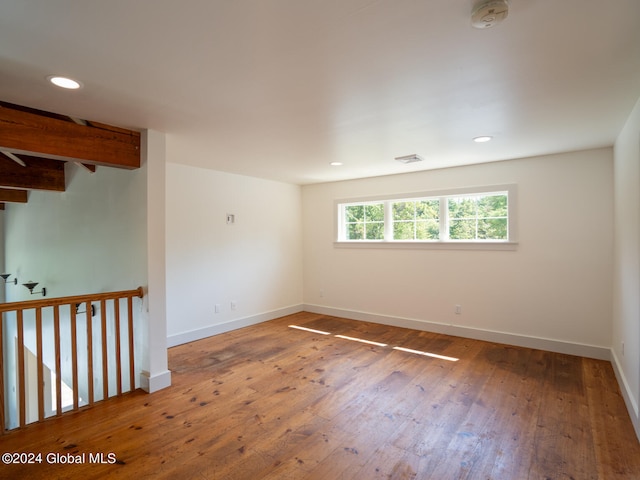 spare room featuring hardwood / wood-style floors