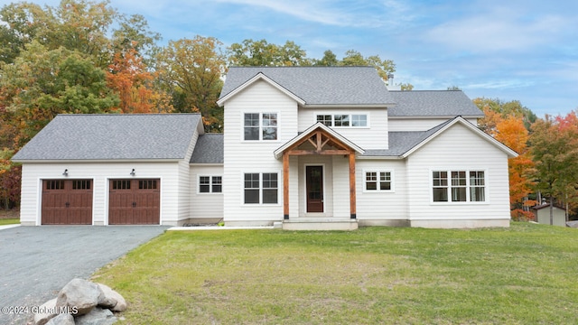 view of front facade with a front lawn and a garage