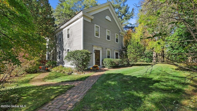 view of property exterior featuring a yard