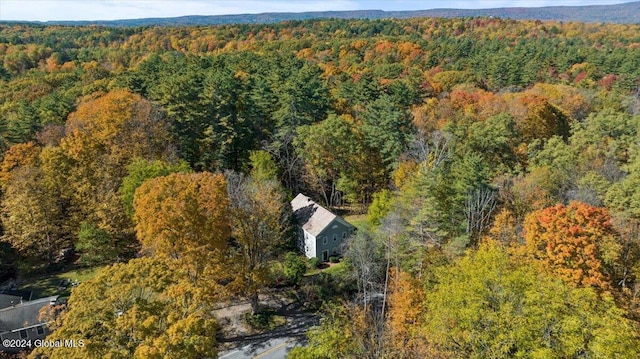 drone / aerial view featuring a view of trees