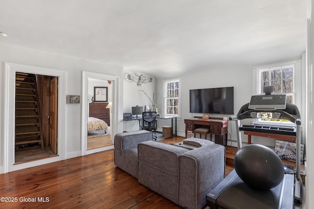 living room with hardwood / wood-style floors and baseboards