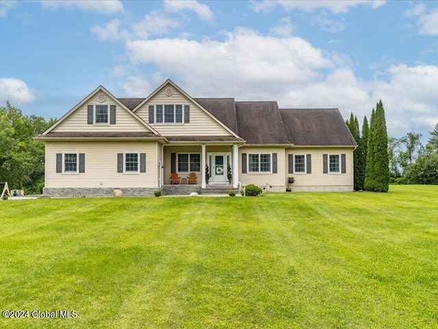 view of front of house featuring a porch and a front lawn