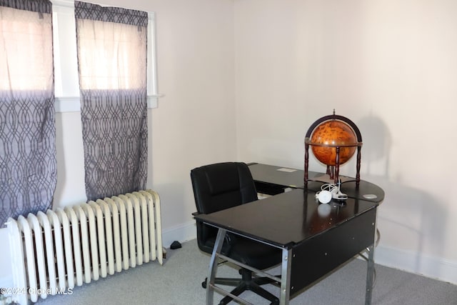 carpeted office with radiator heating unit