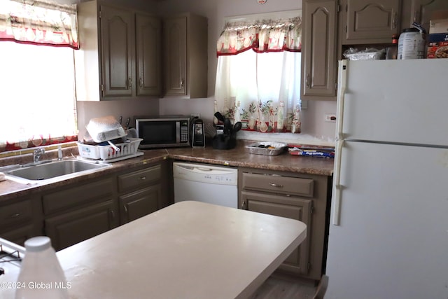 kitchen with sink and white appliances